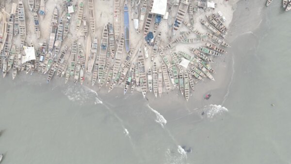 Boats Shore Beach Community Settlement Fishing Top Down Pan View