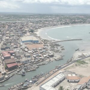 Elmina Castle Harbor Wide Shot Boats Shoreline