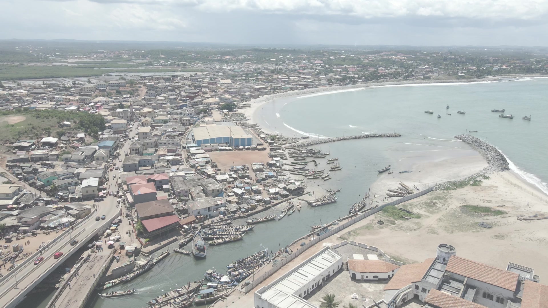 Elmina Castle Harbor Wide Shot Boats Shoreline