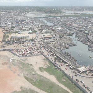 Elmina Castle Harbor Wide Shot Spin Boats Shoreline Full