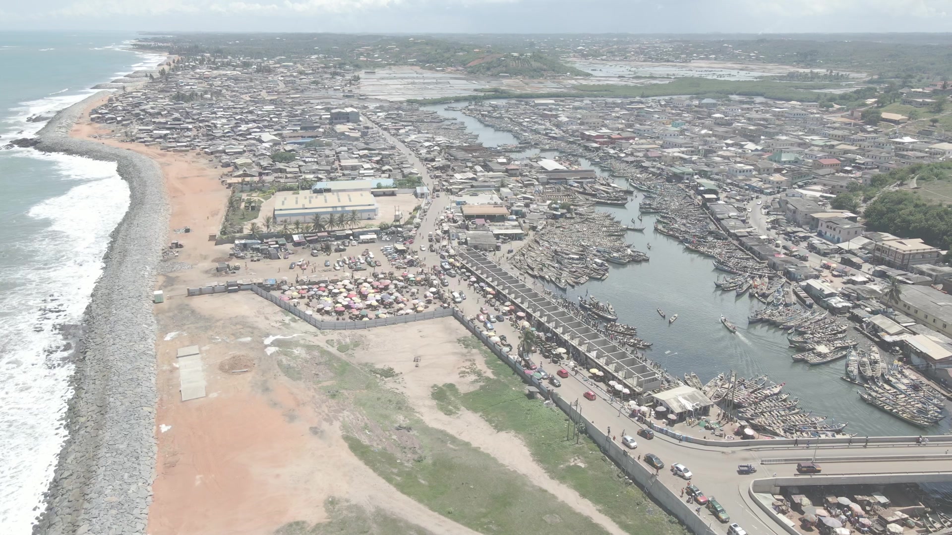 Elmina Castle Harbor Wide Shot Spin Boats Shoreline Full