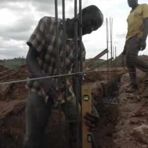 Construction Mason Checks Alignment Foundation