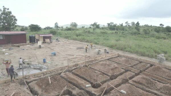 Construction Workers Mixing Mortar