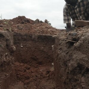 Laborer Digging Foundation Building