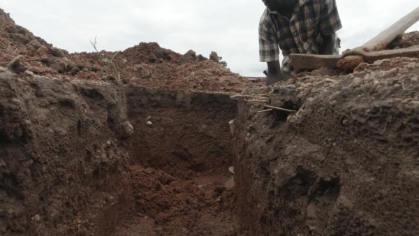 Laborer Digging Foundation Building