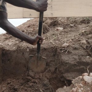 Laborer Digging Foundation Building Shoveling