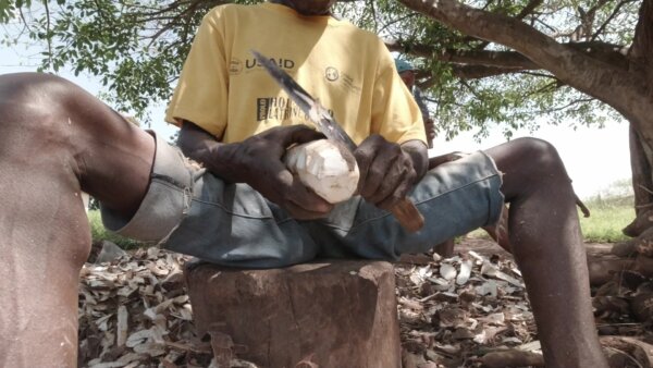 Man Peels Cassava Fast