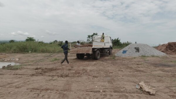 Offloading Iron Rod From Truck On Site Construction