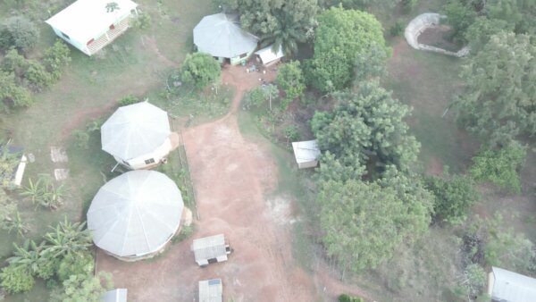 Remote Settlement Community Houses Forest Top Down View Orbit Arc