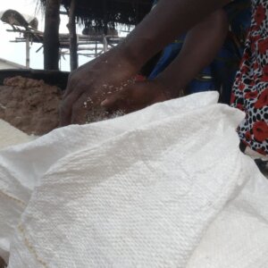 Woman Packages Gari Into Bag