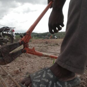 Worker Cut Iron Rods