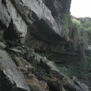 Akumersu Waterfalls Reveal Huge Rock Cliff Man Stands On Rocks